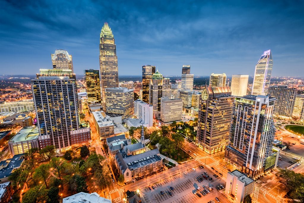A nighttime cityscape of Charlotte's buildings