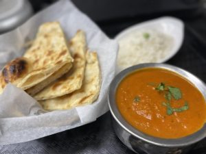 Curry with naan bread from Sarangi, Indian and Nepali Cuisine in Charlotte