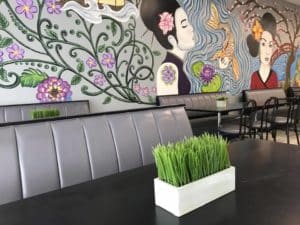 Mural and seating at Sushi Queen Sushi and Grill in Charlotte